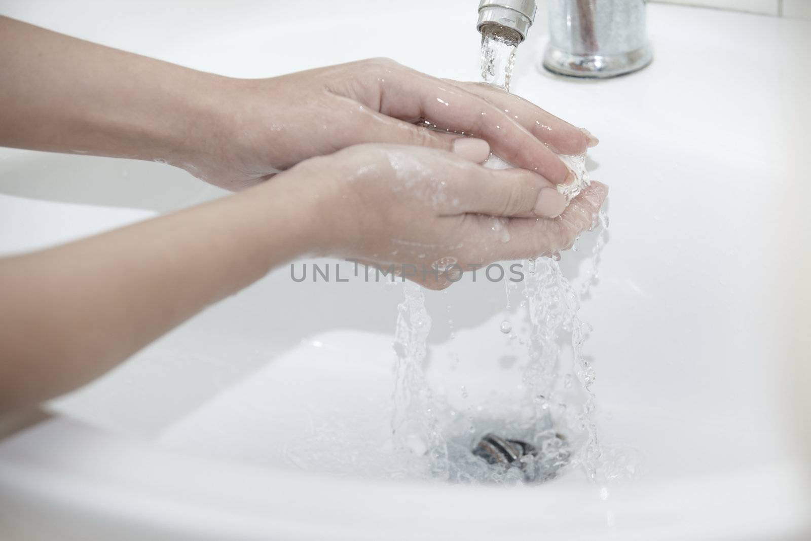 Human washing hands with soap. Close-up photo