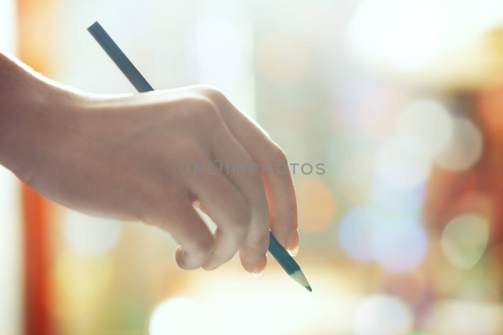 Hand with green pencil by Novic