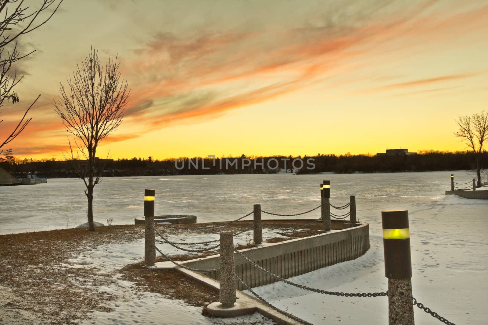 Wascana lake frozen on a cold November day during winter in Regina, Canada.