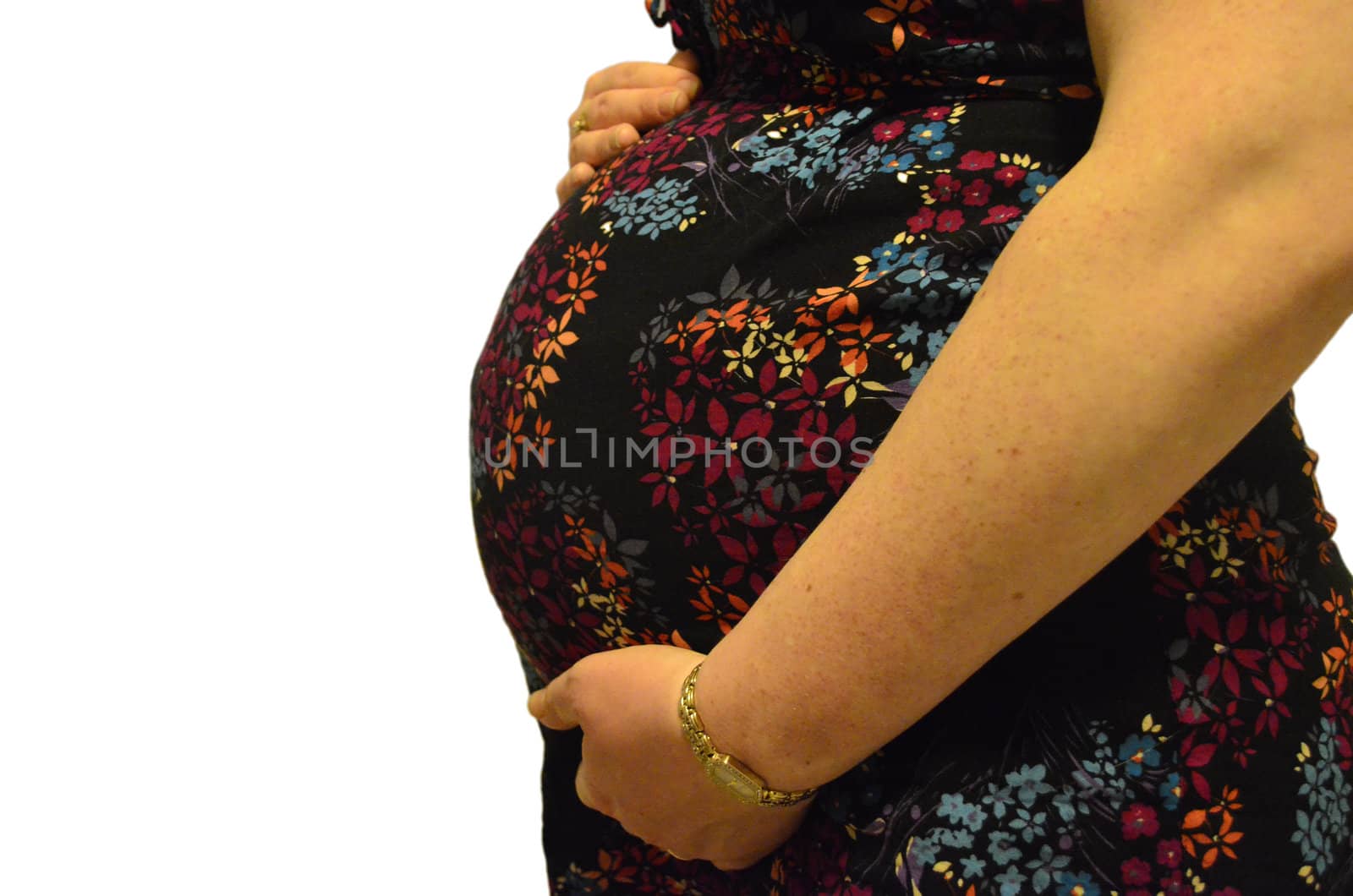 Isolated pregnant lady with colourful dress showing bump