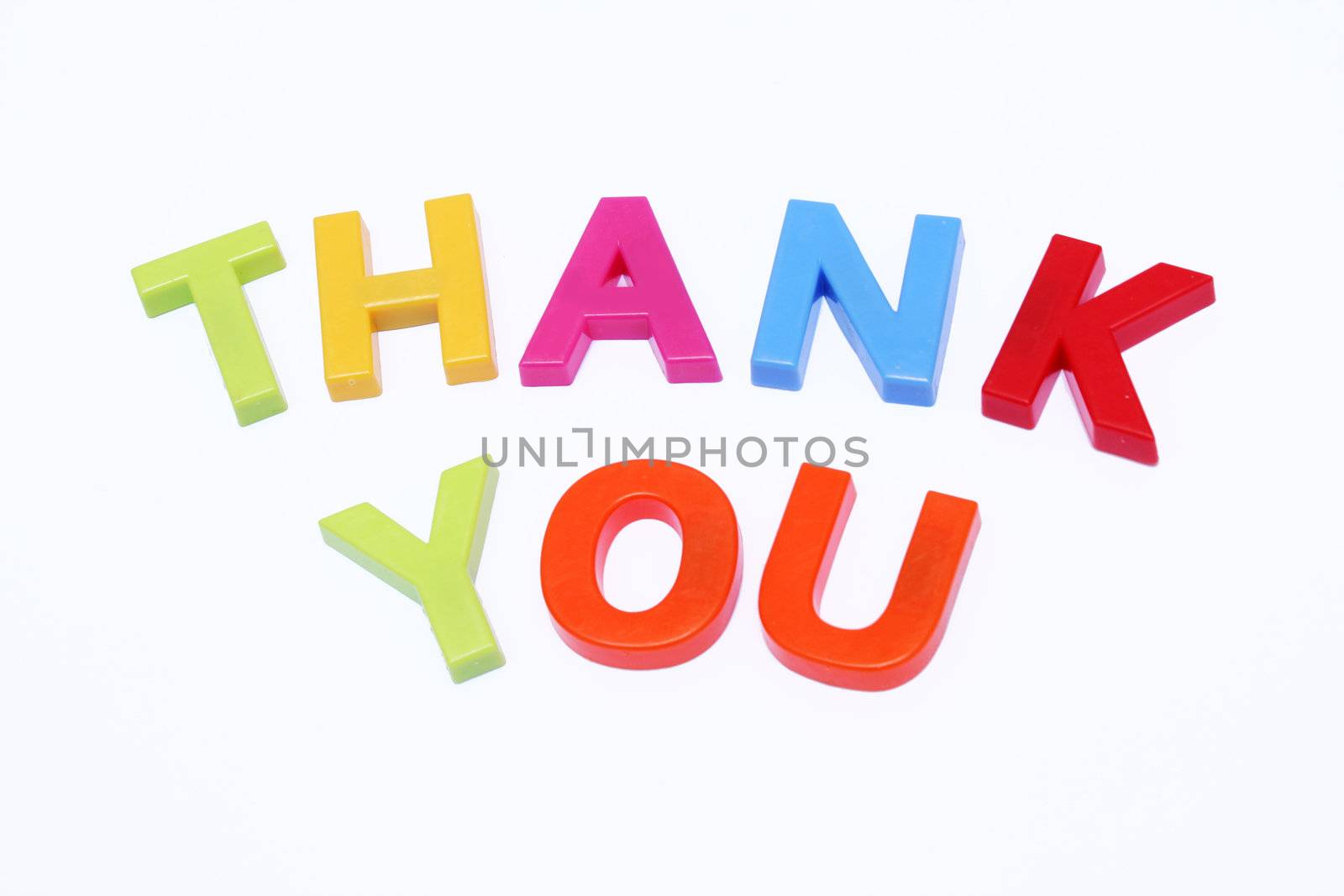 fridge magnet spelt out thank you isolated on white