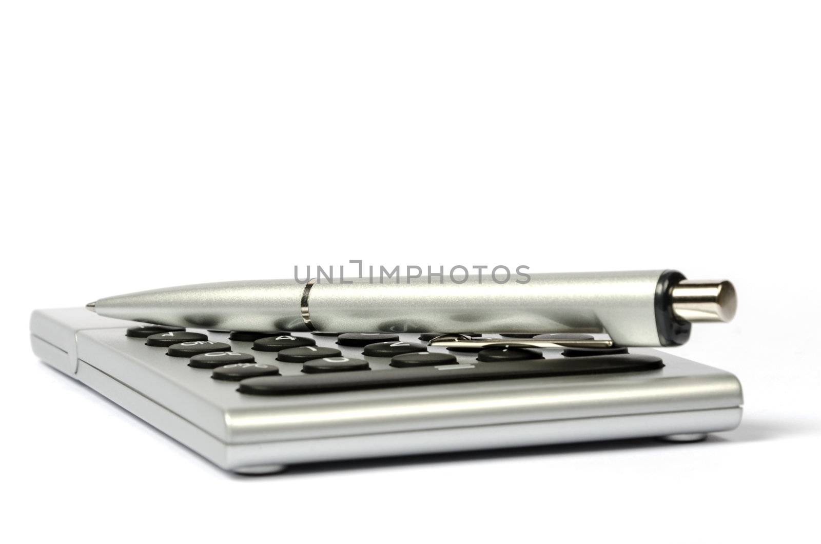 A side view of the calculator and a pen
