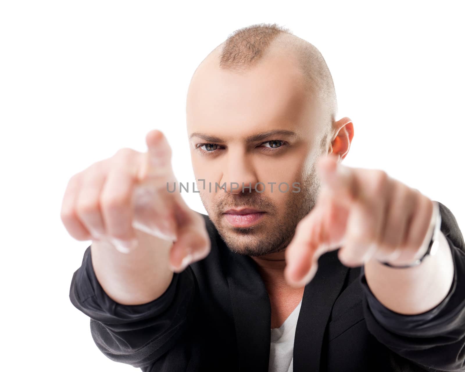 Young handsome male pointing at camera with both hands, focus on face, isolated