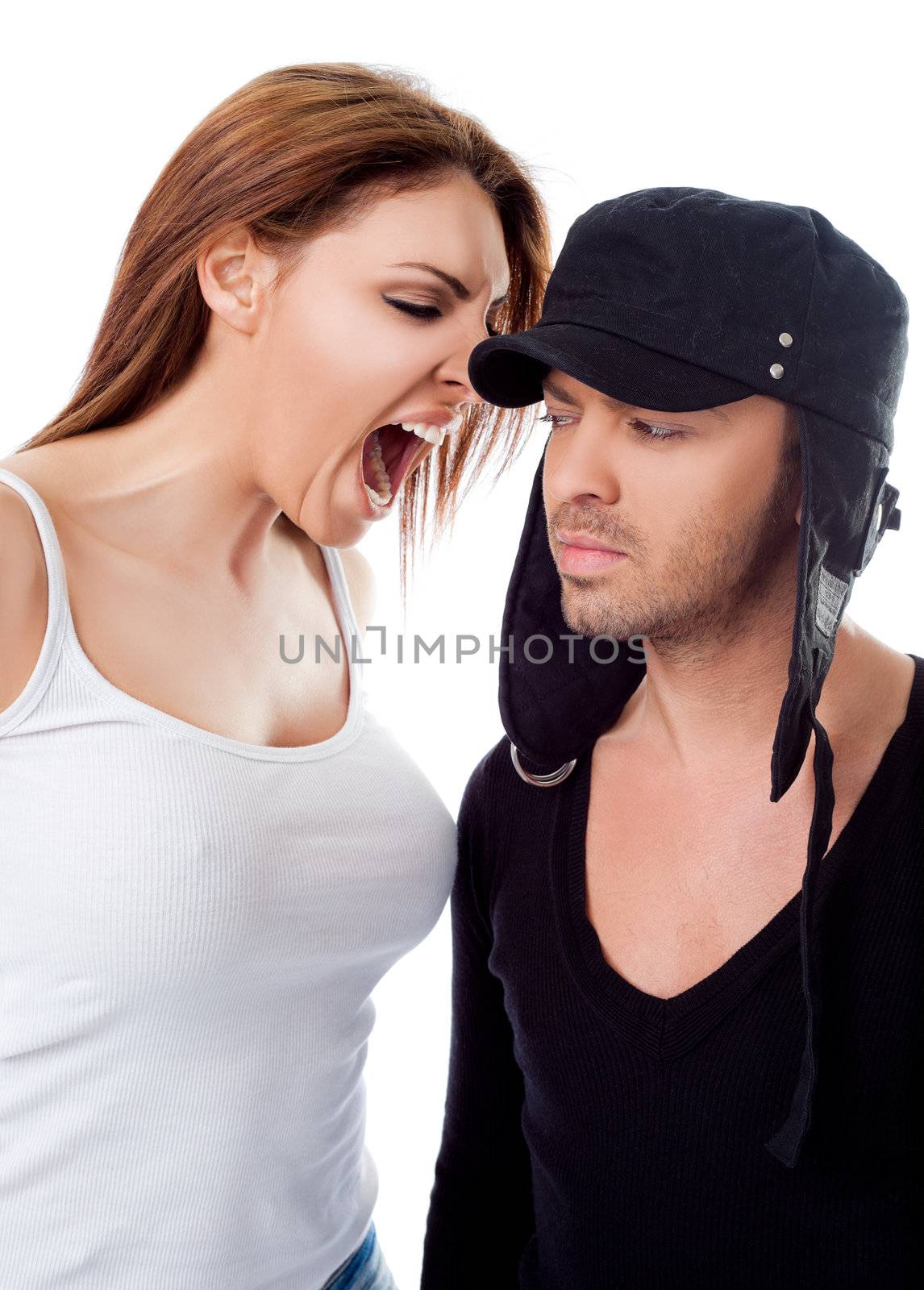 Young woman screaming at man's ear on white background