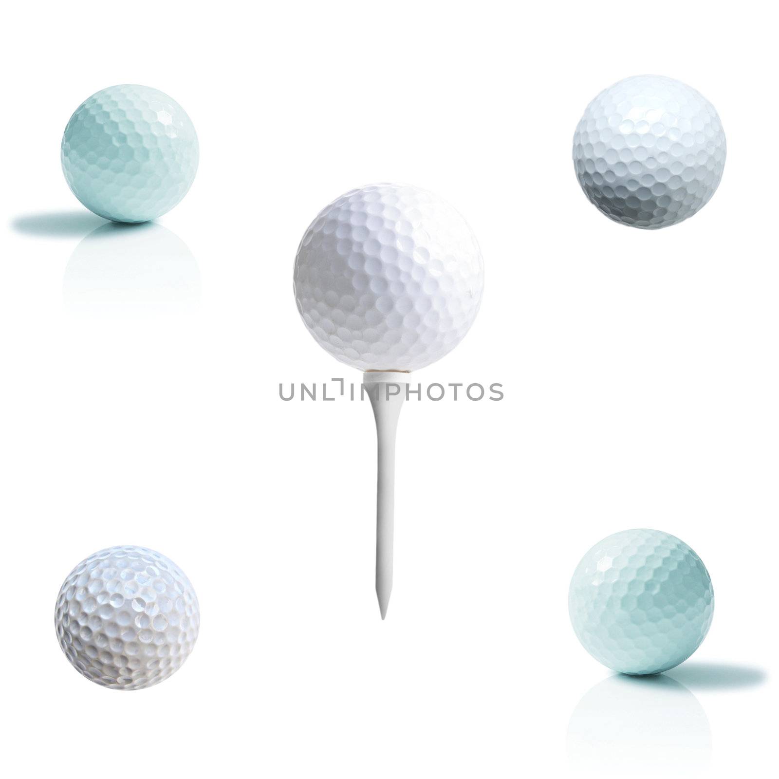 Golf ball on a tee isolated on white by ozaiachin