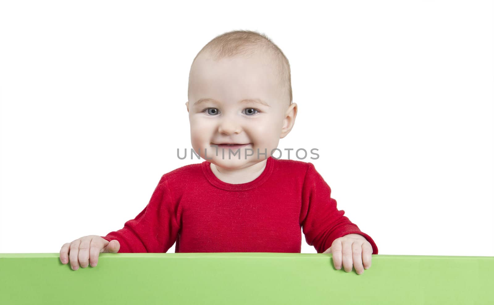 young child holding green shield. isolate on white background