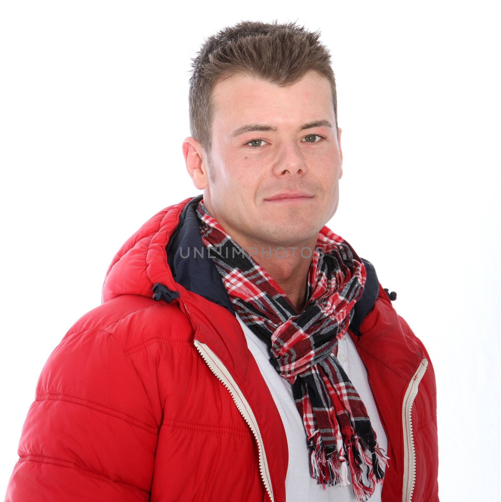 Brunette man with red jacket posing over the white background