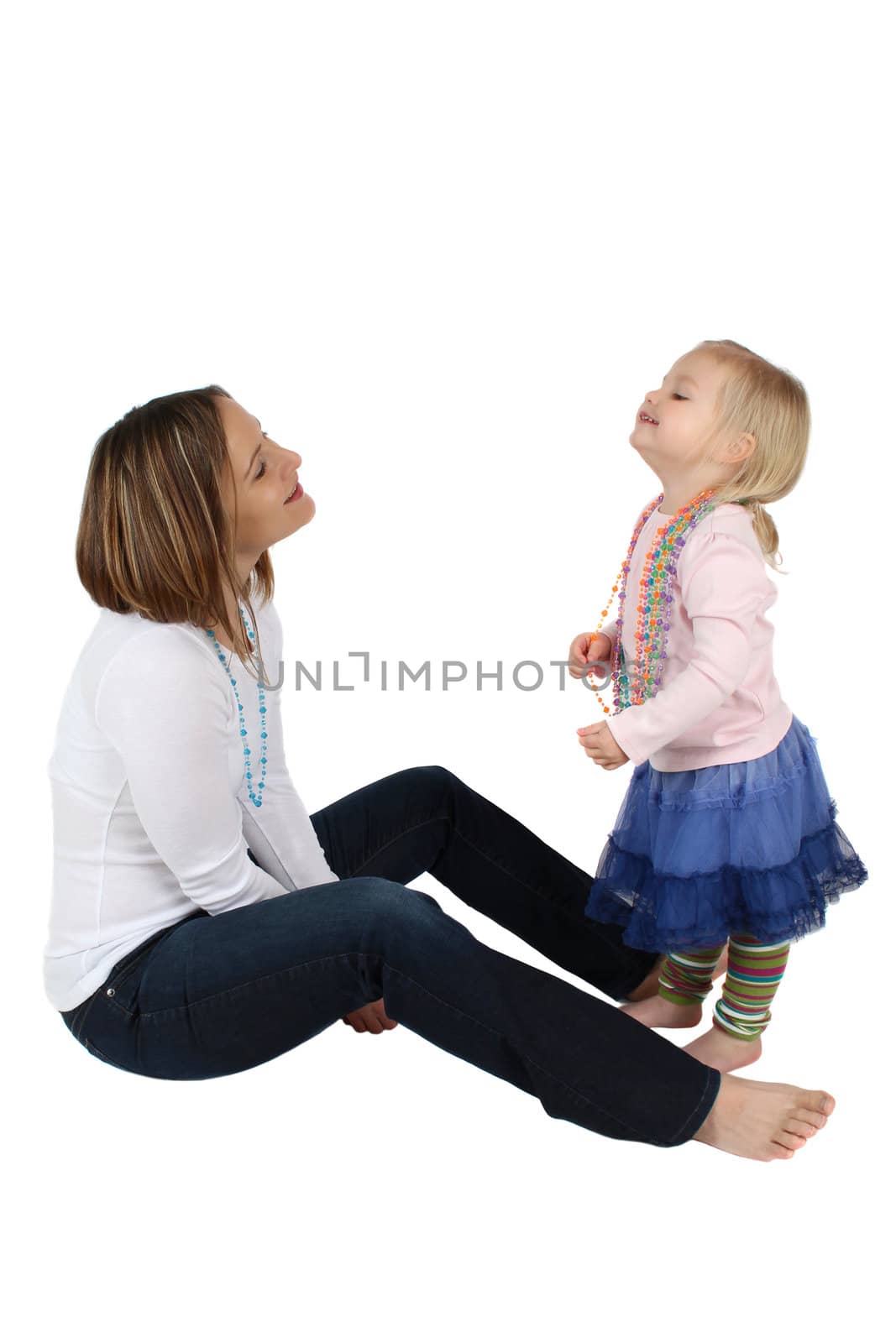 Mother and daughter playing on a white bacgkround