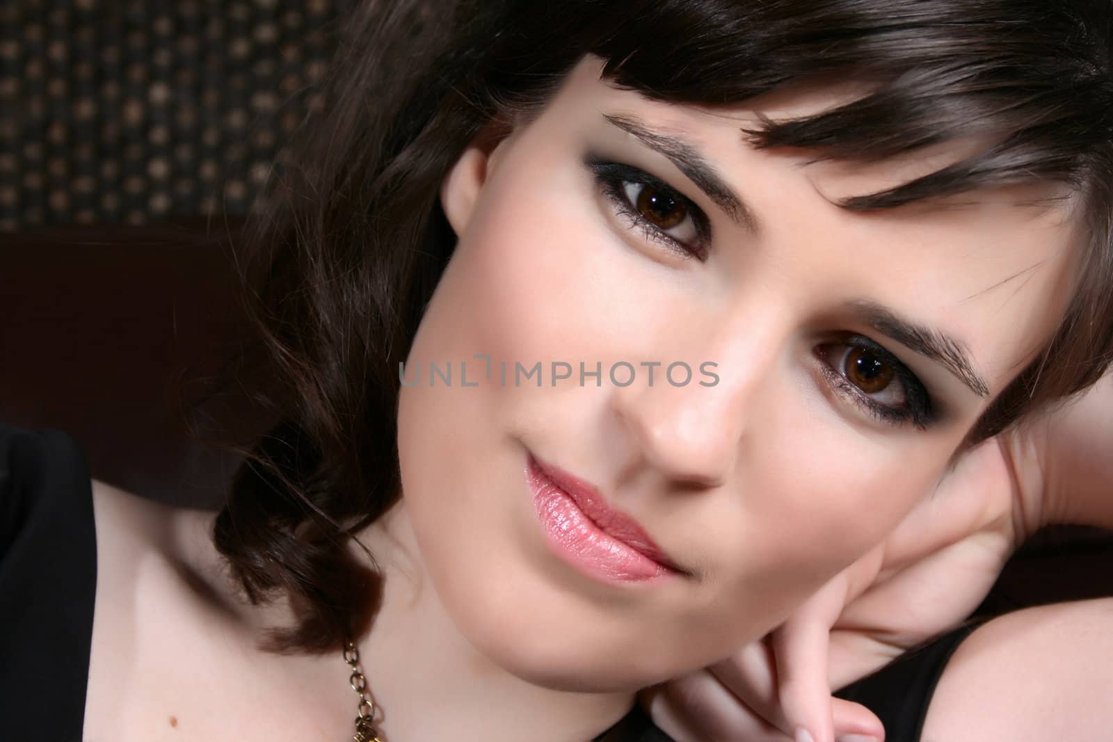 Brunette female model with intense brown eyes