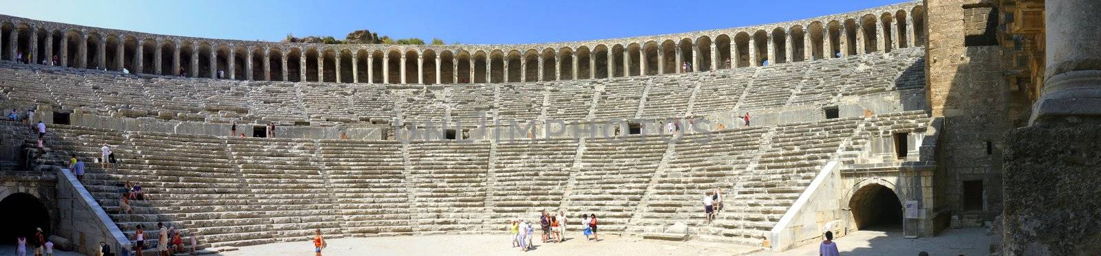 Aspendos, Turkey - September 04, 2008: Autumn day. Peoples walk in the old greek amphitheater Aspendos on September 04, 2008 in Aspendos, Turkey