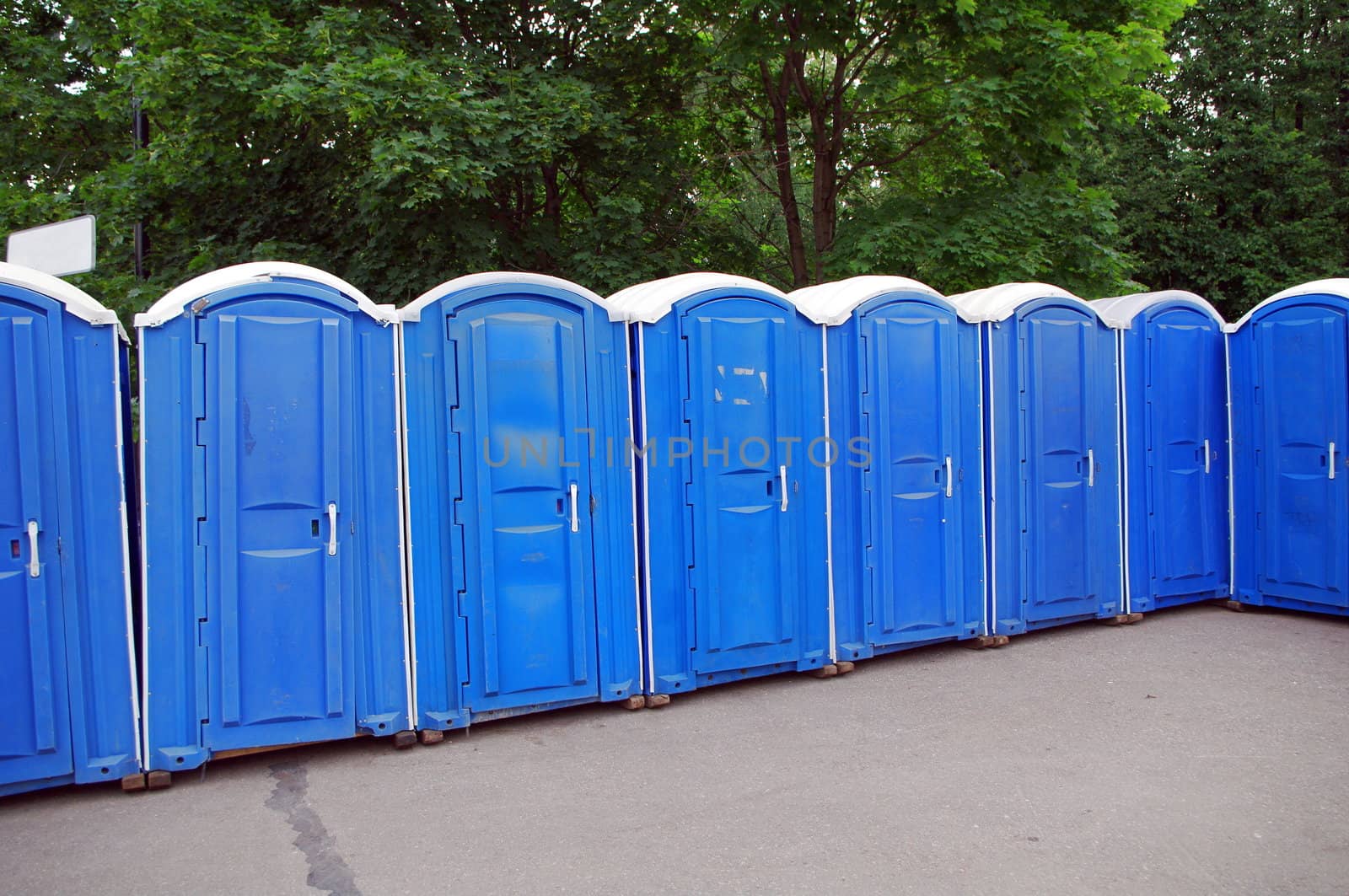 Row of blue public toilets in Moscow park by Stoyanov