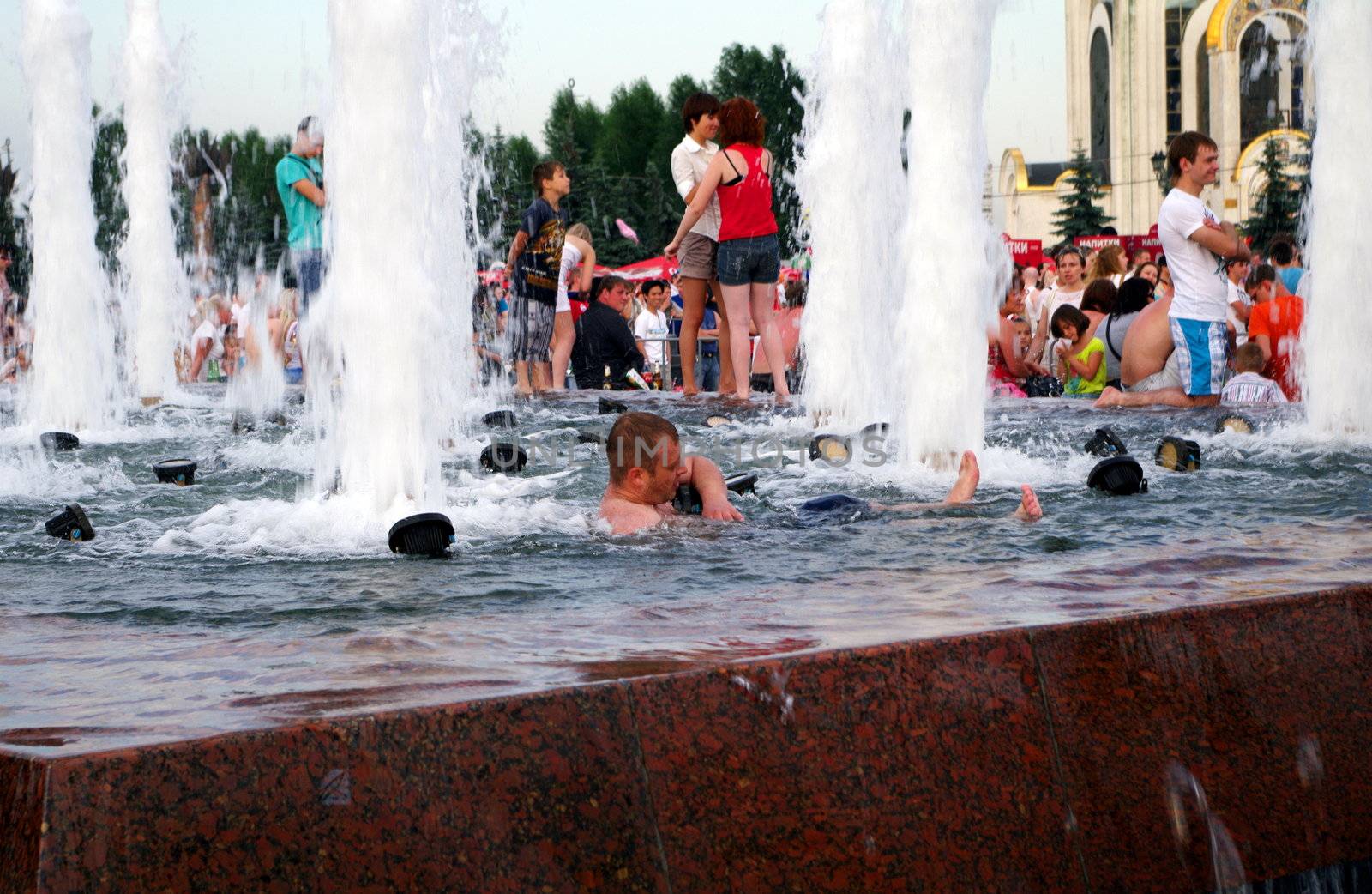 Moscow, Russia - June 26, 2010: Summer day. Peoples have fun in youth day celebration on June 26, 2010 at victory park in Moscow, Russia by Stoyanov