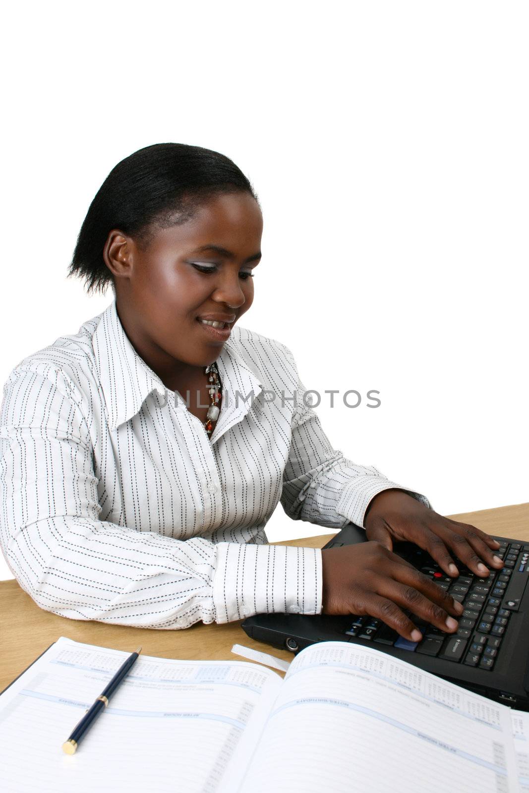 Business woman working on a laptop computer 