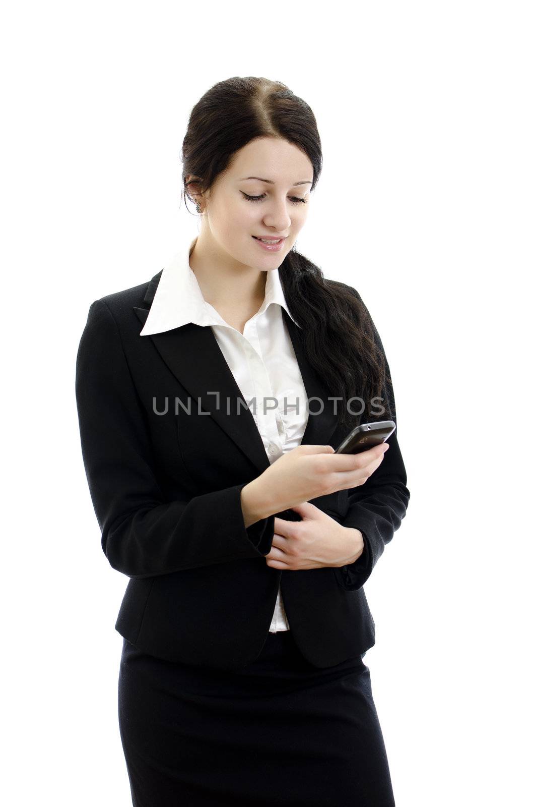 Portrait of a young attractive business woman with mobile phone. Isolated on white.