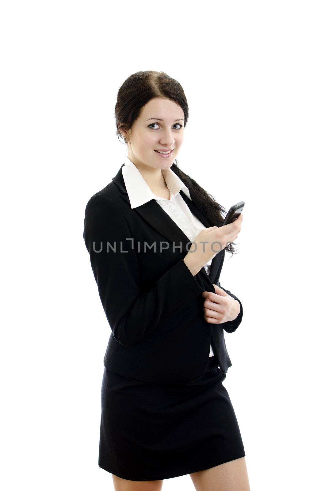 Portrait of a young attractive business woman with mobile phone. Isolated on white.