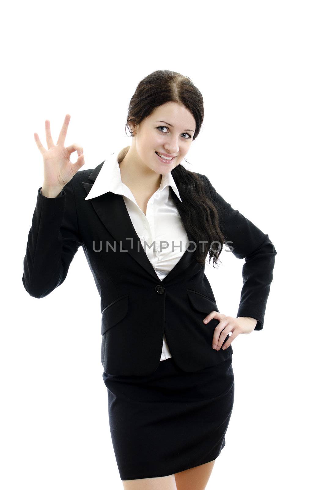 Portrait of business woman gesturing okay sign. Isolated on white.