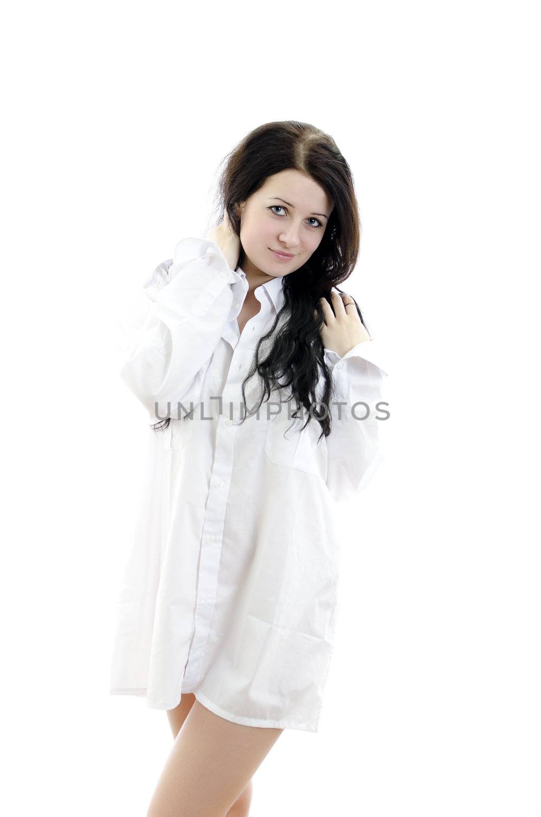 Sensual brunette girl in man's shirt. Isolated on white.