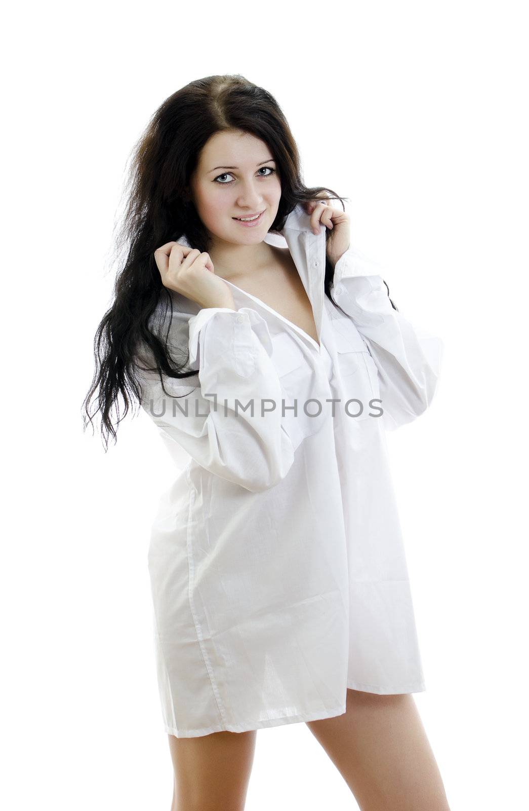 Sensual brunette girl in man's shirt. Isolated on white.