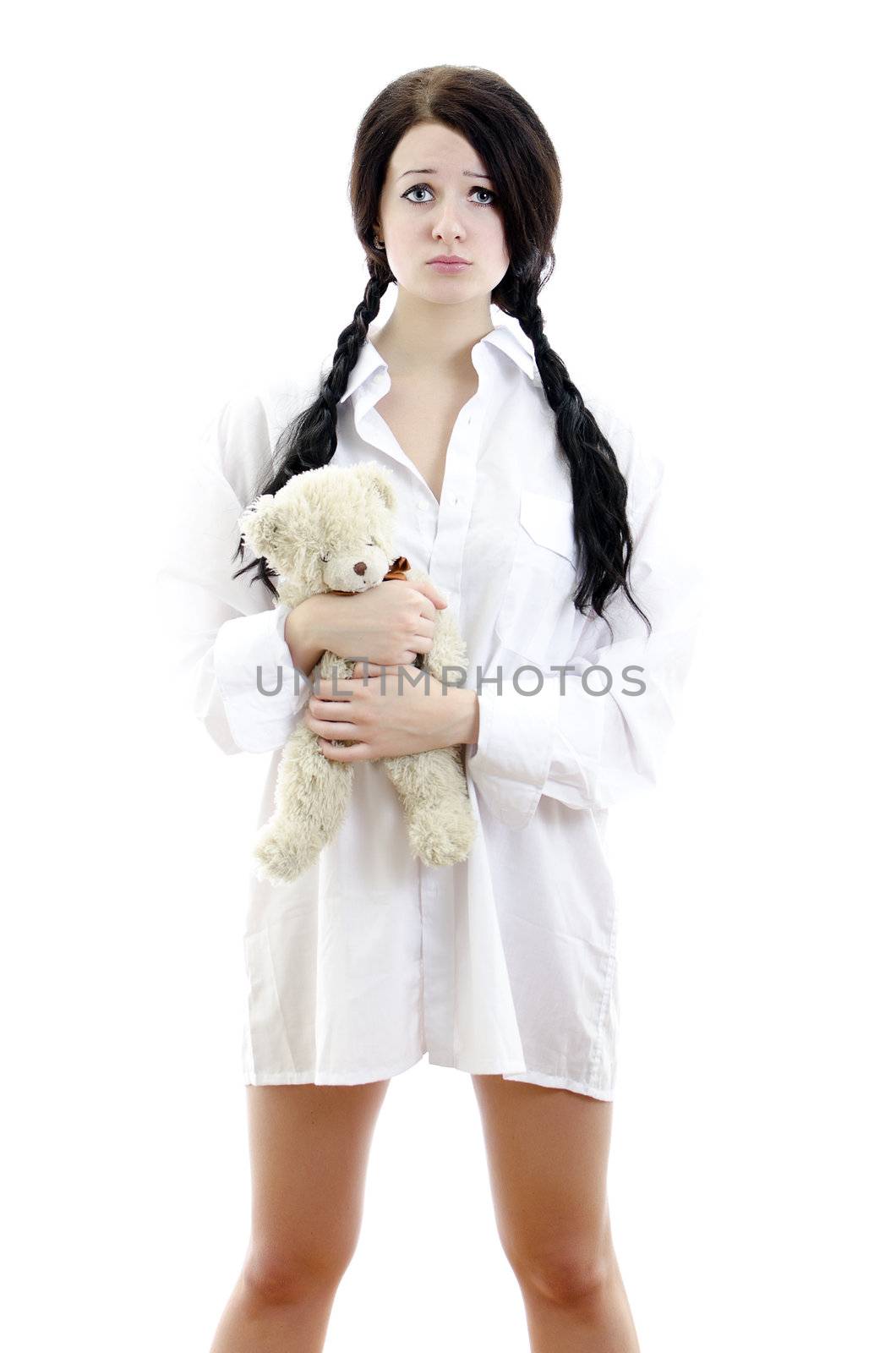 Sensual brunette girl in man's shirt with Teddy Bear. Isolated on white. by dmitrimaruta