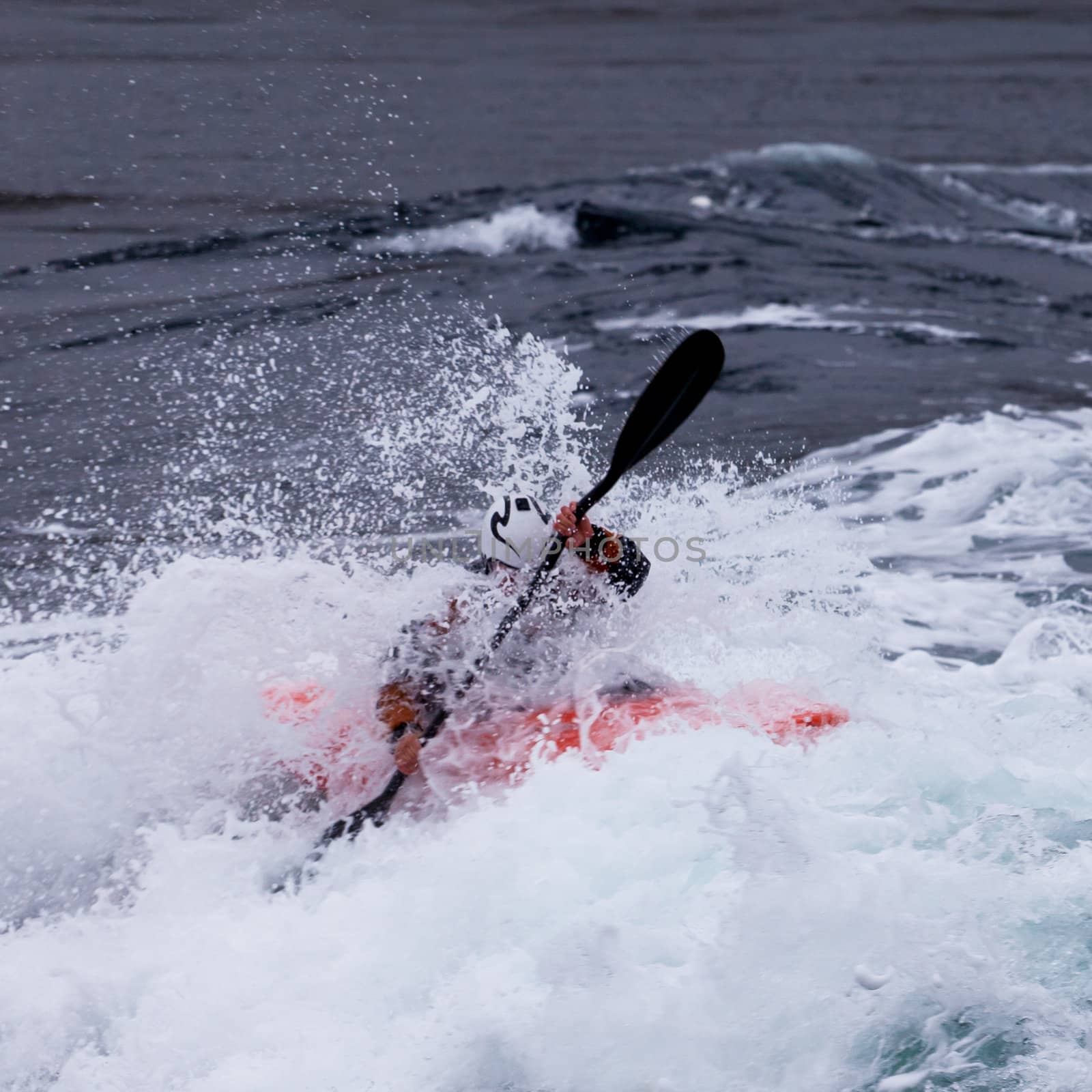 Kayaker in white water paddling breaking waves by PiLens