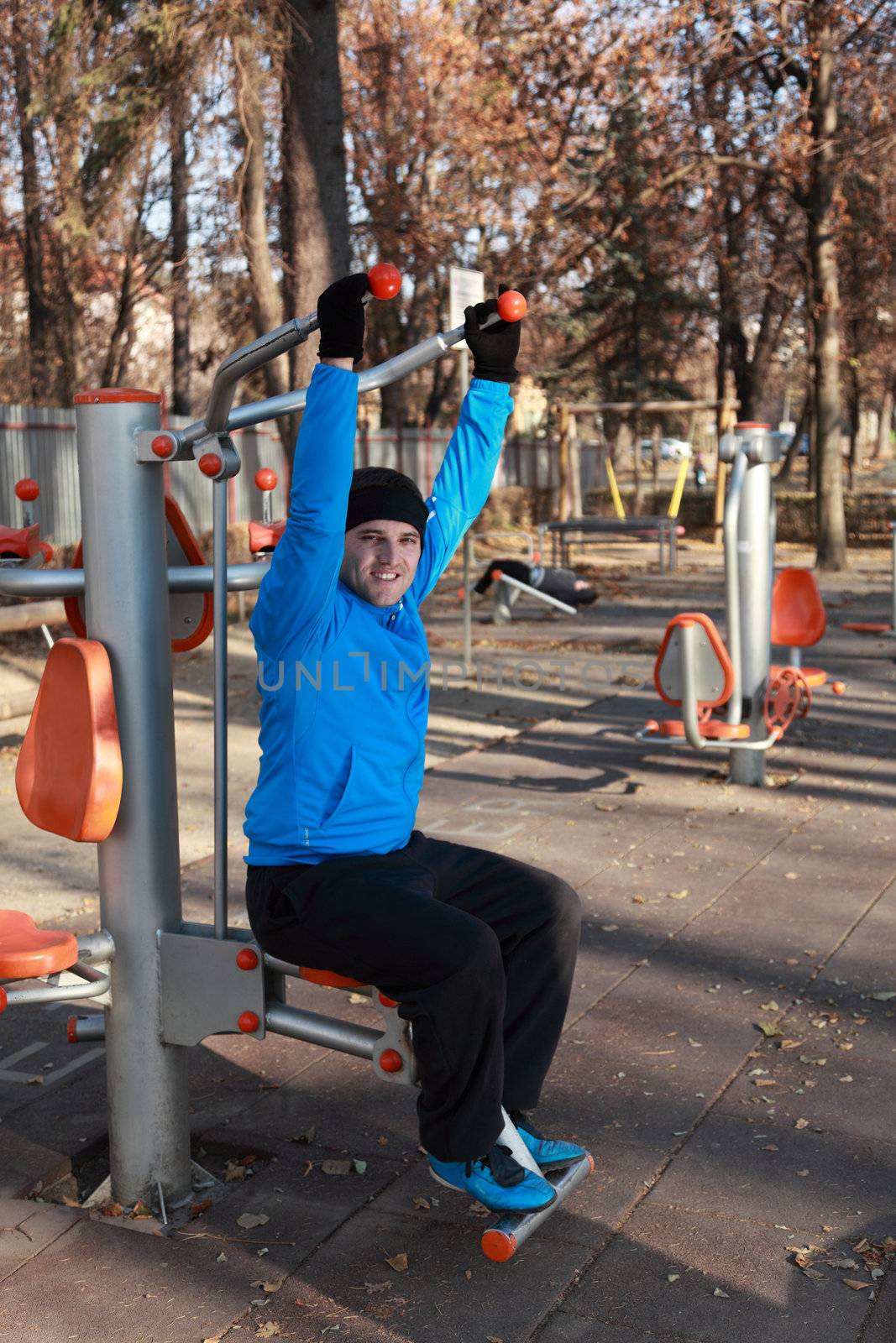 Man doing exercise outdoors in a public park.