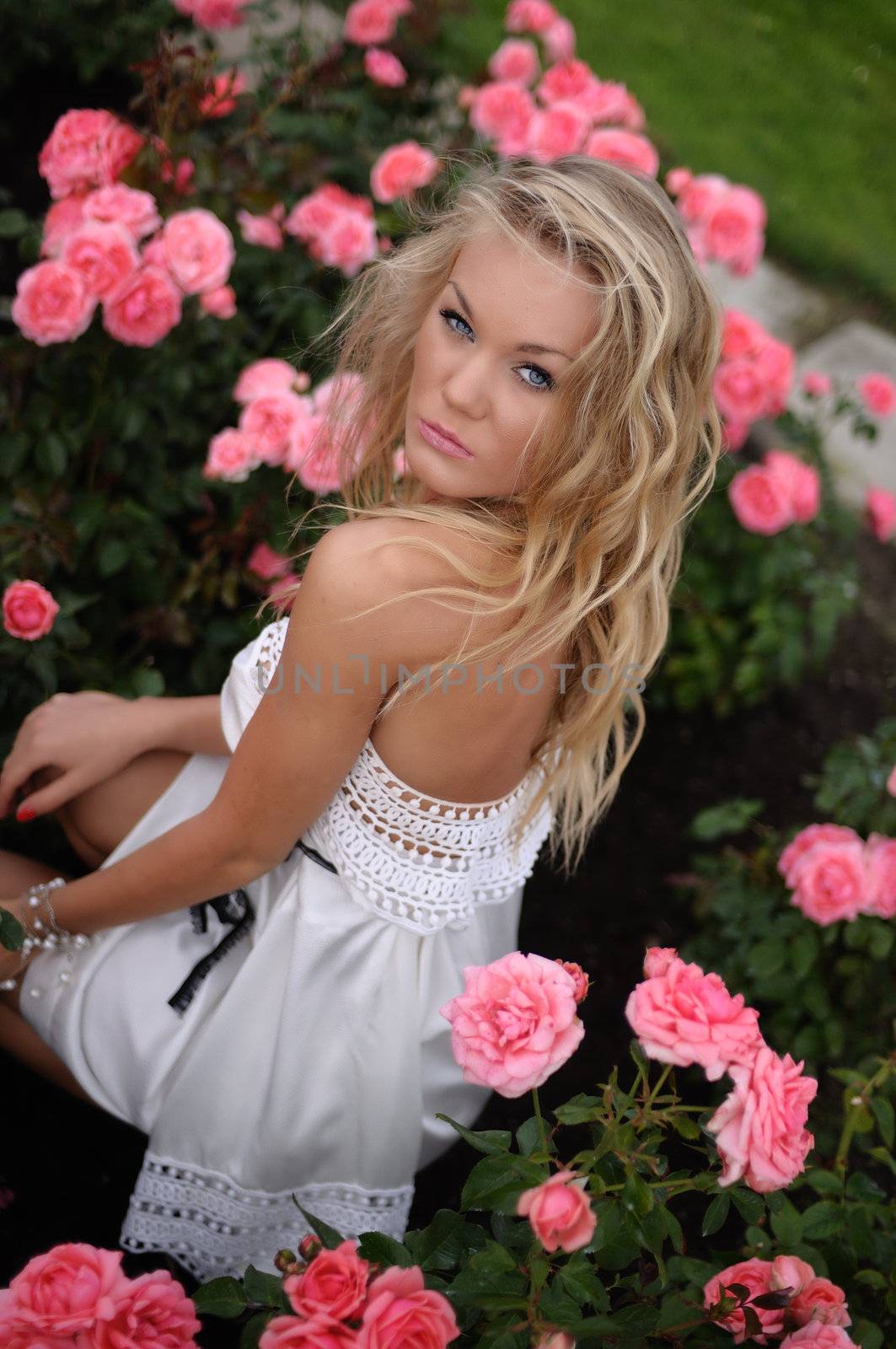 Smiing Blond In Pink Roses by peterveiler