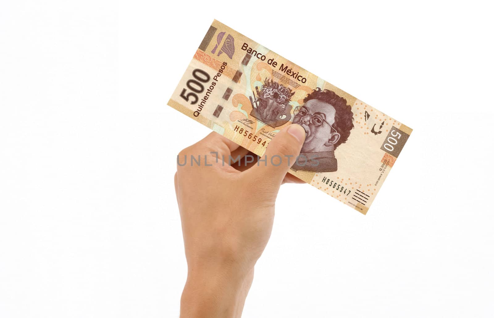 Hand holding 500 Mexican Pesos Bill islolated on white background.