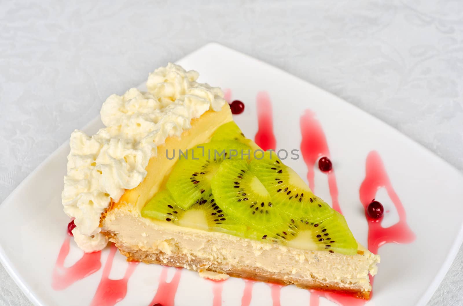 tasty kiwi fresh cake closeup at plate