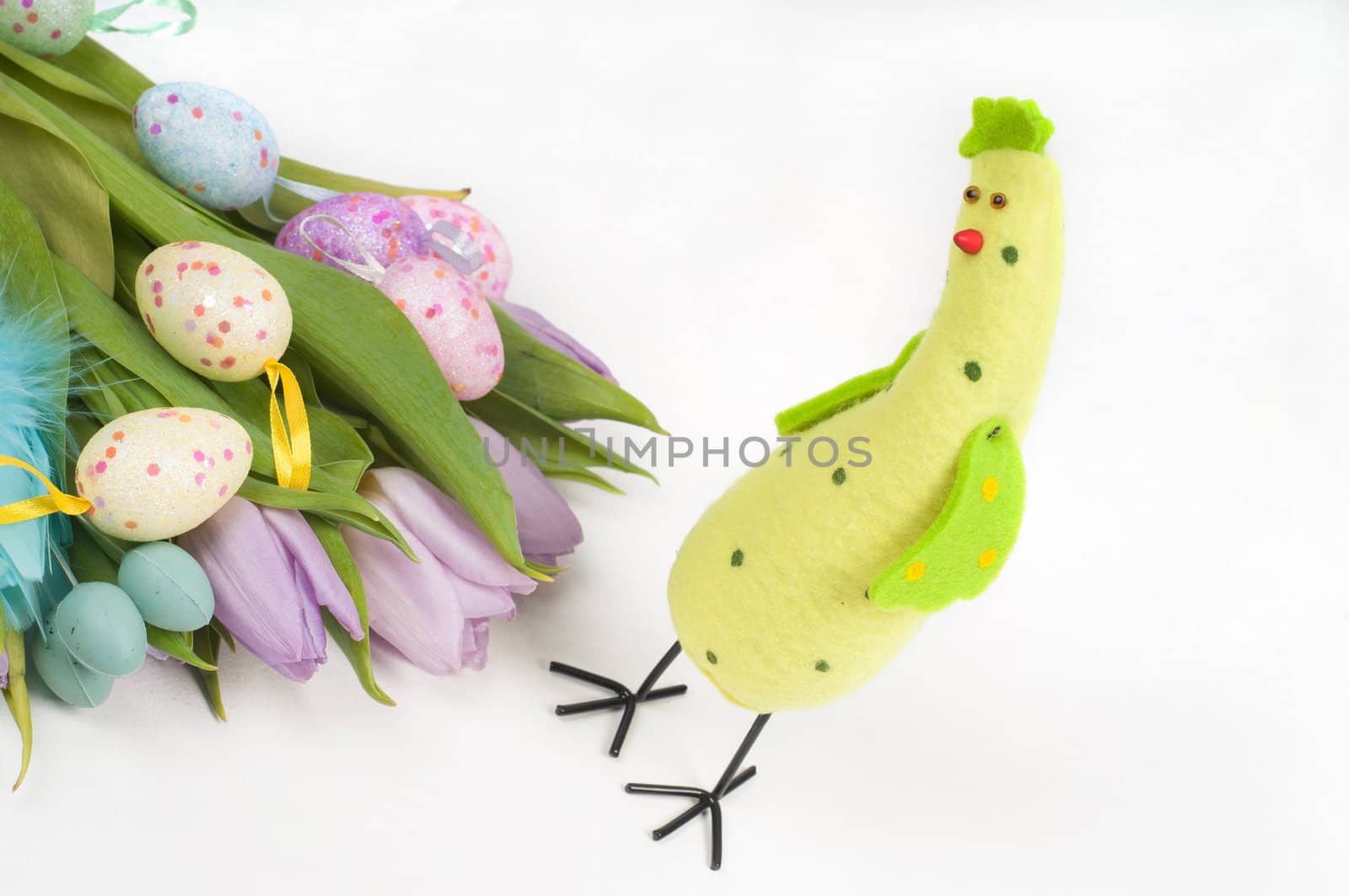 Easter chicken with tulips and eggs on light background