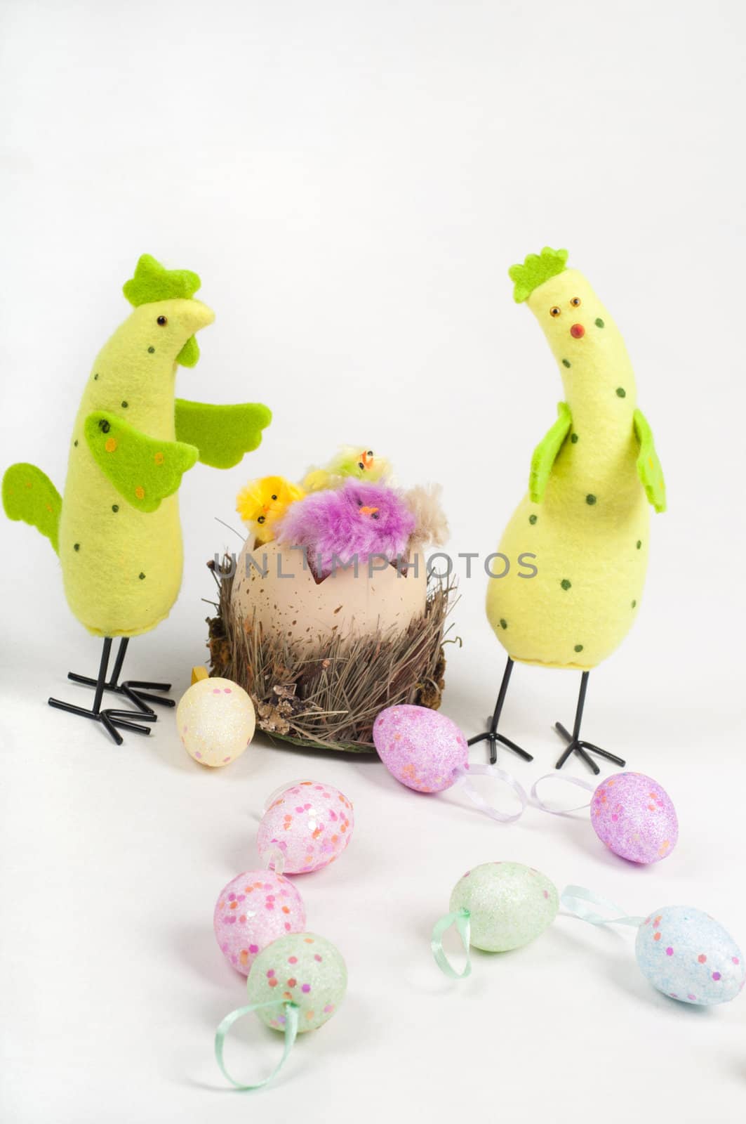 Easter chicken family with tulips and eggs on light background
