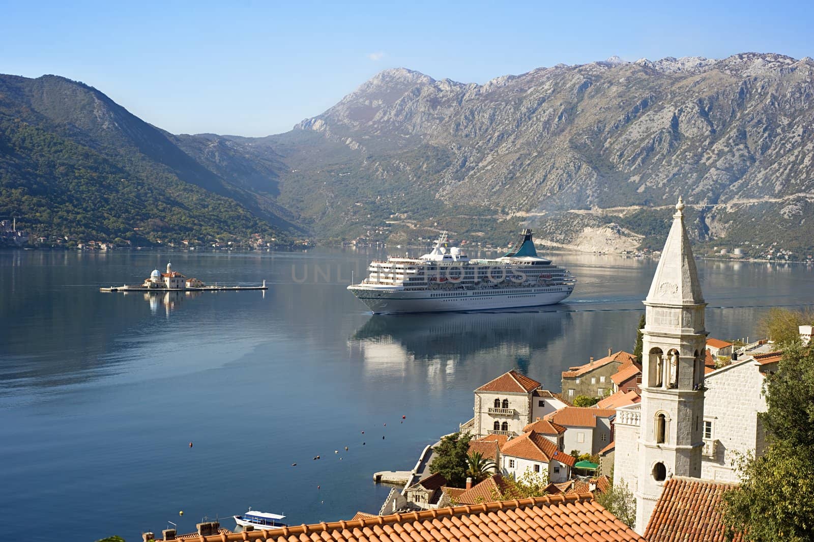 Aerial view on town Perast with Church "Our Lady of the rocks" and cruise liner. Montenegro