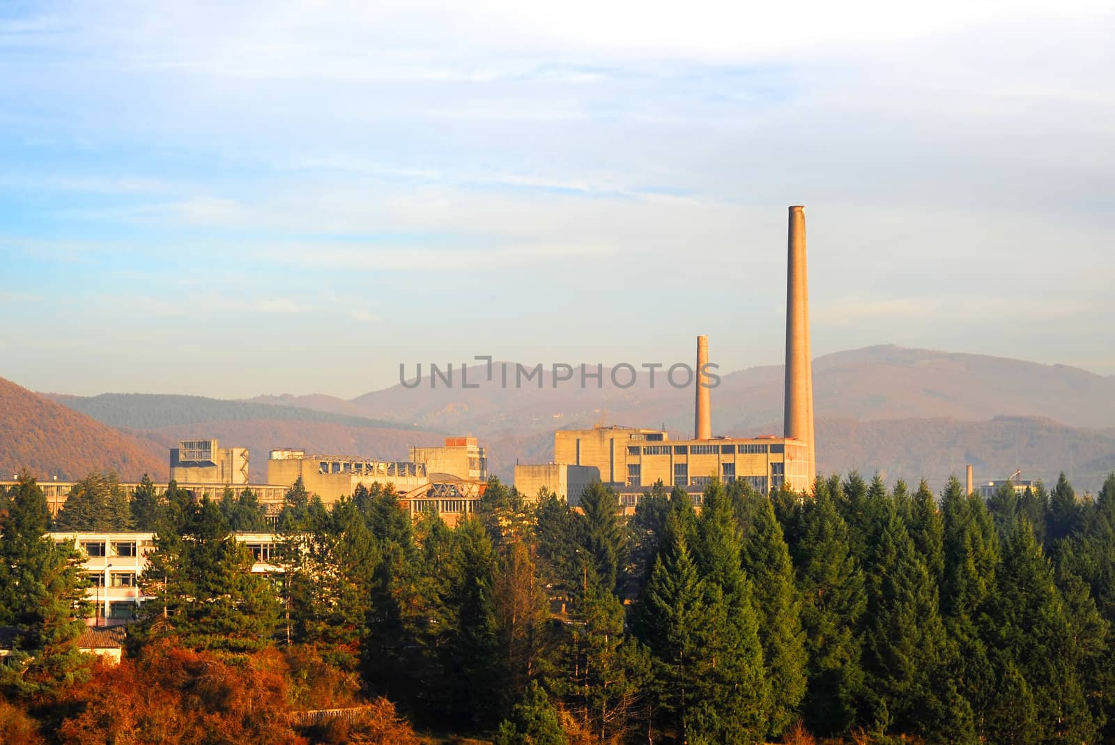 Factory surrounded by lush forest . Berane, Montenegro