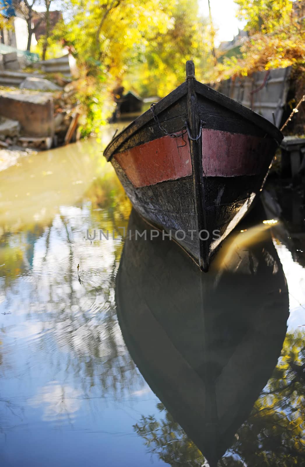 Small boat in Vylkove. Vylkove is also known as "The Ukrainian Venice" thanks to a number of channels excavated inside its territory � the reason why boating is a more common method of transport than an automobile.