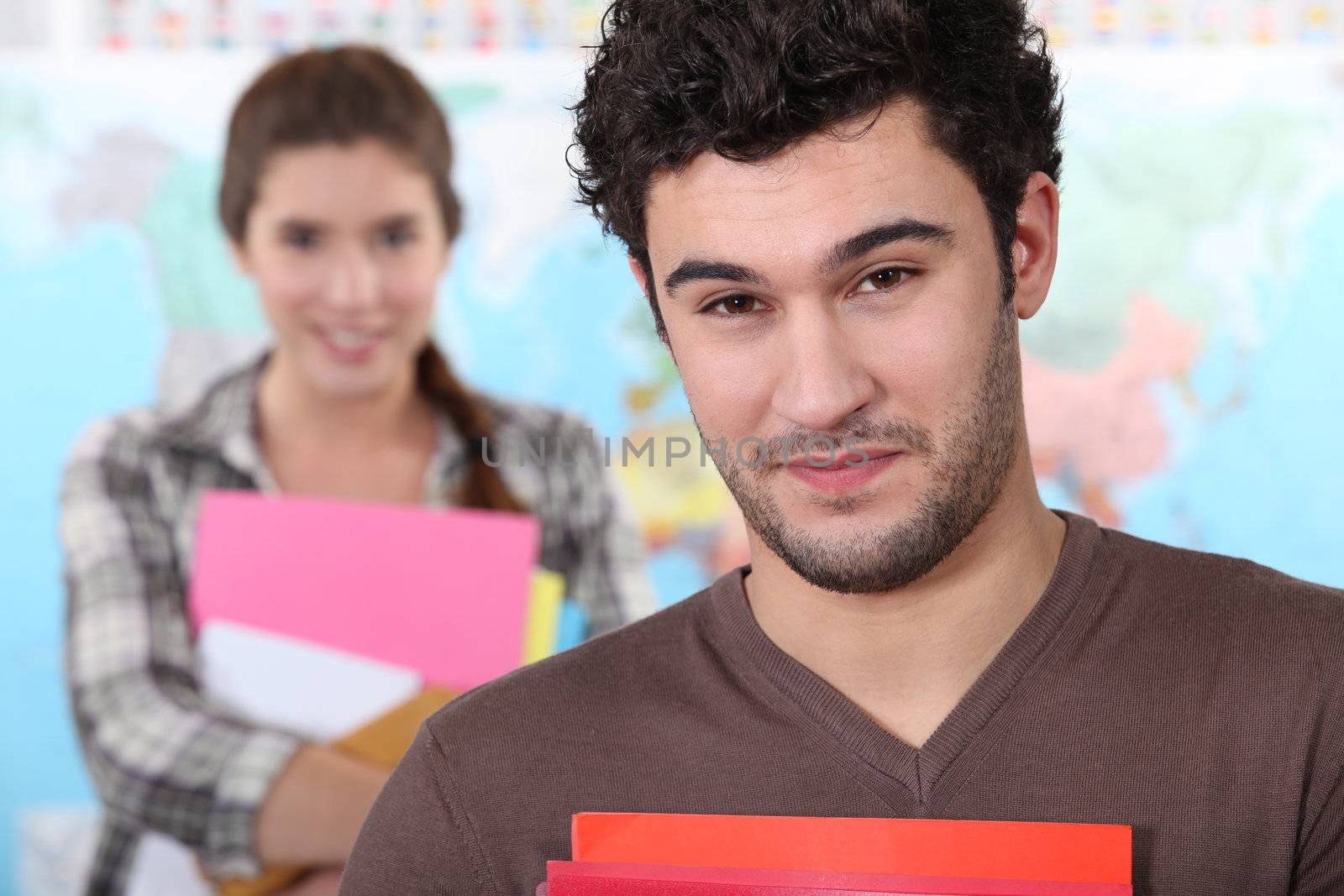 Two college students in class