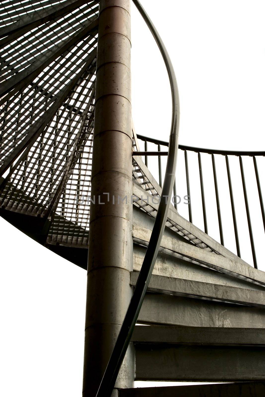 A spiral staircase made in metal isolated on white.