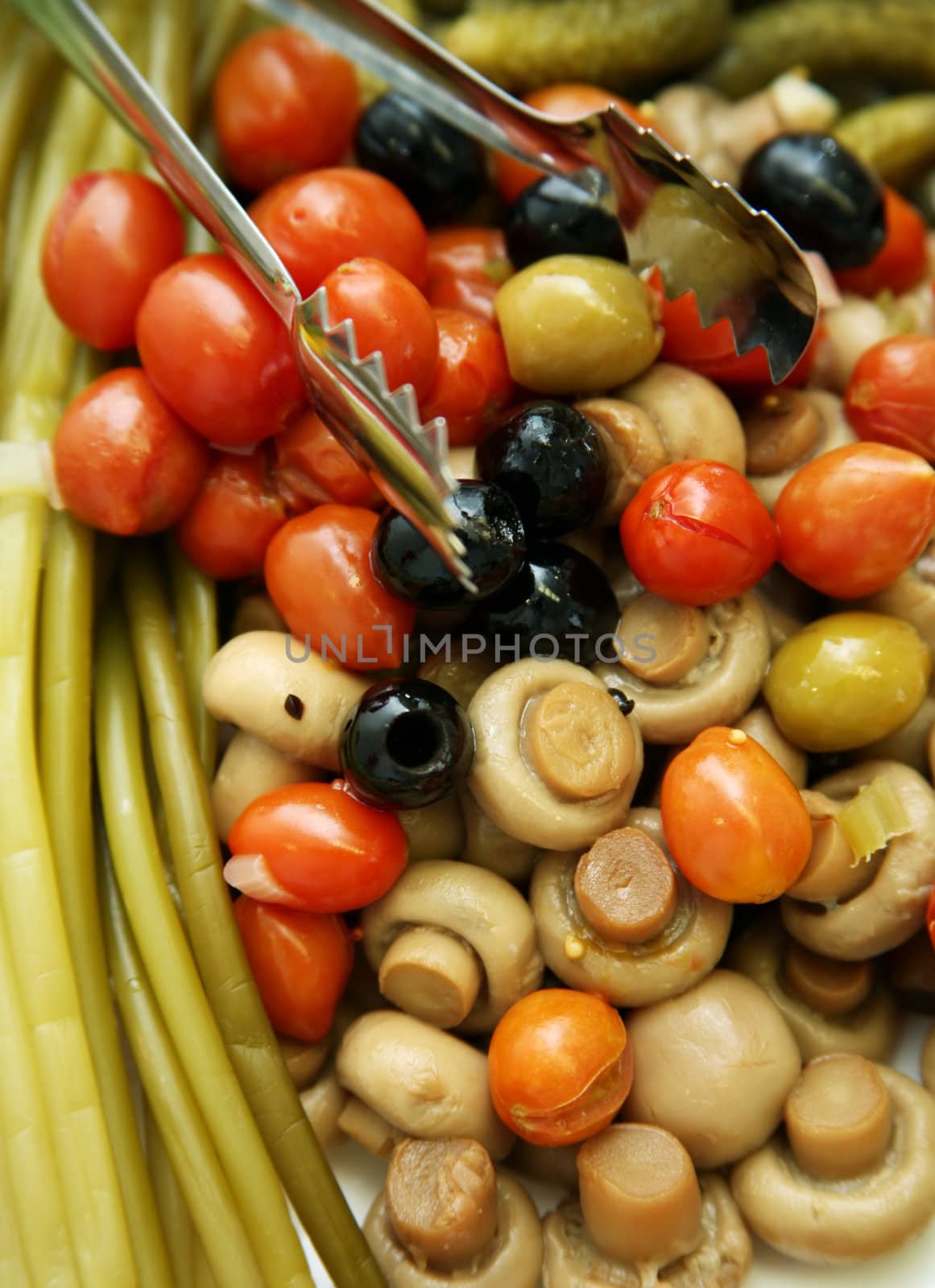 The olives, pickled tomatoes and mushrooms