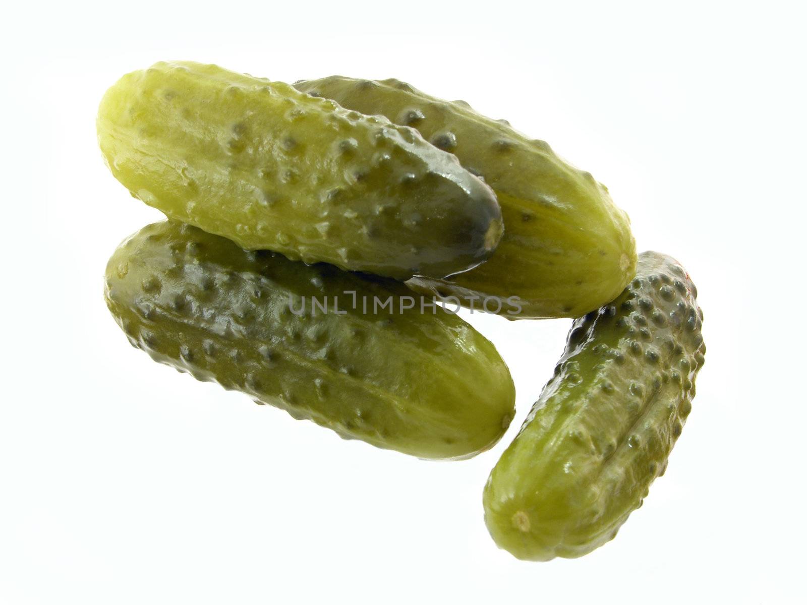 dill pickles on the white background 