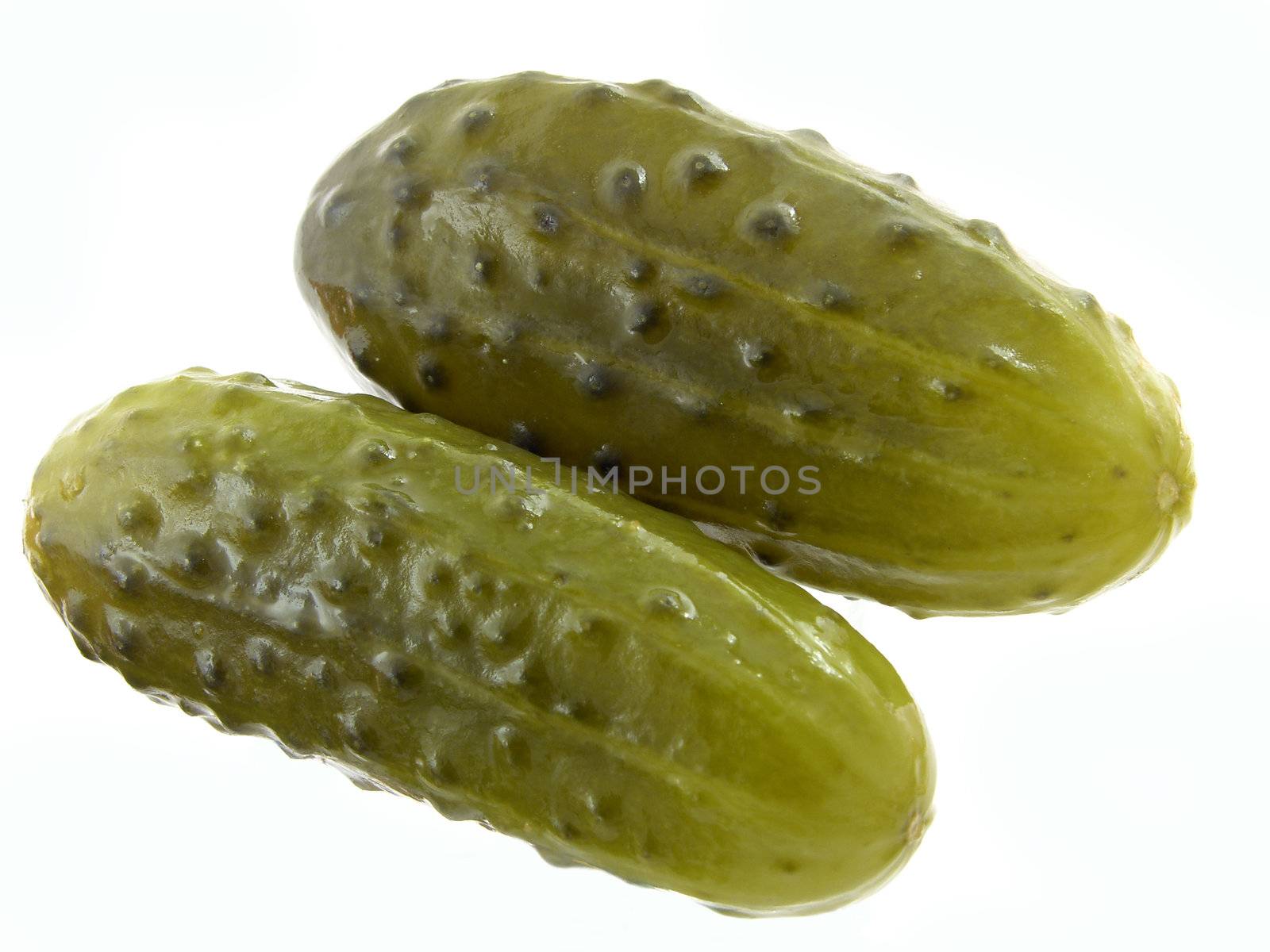 dill pickles on the white background 