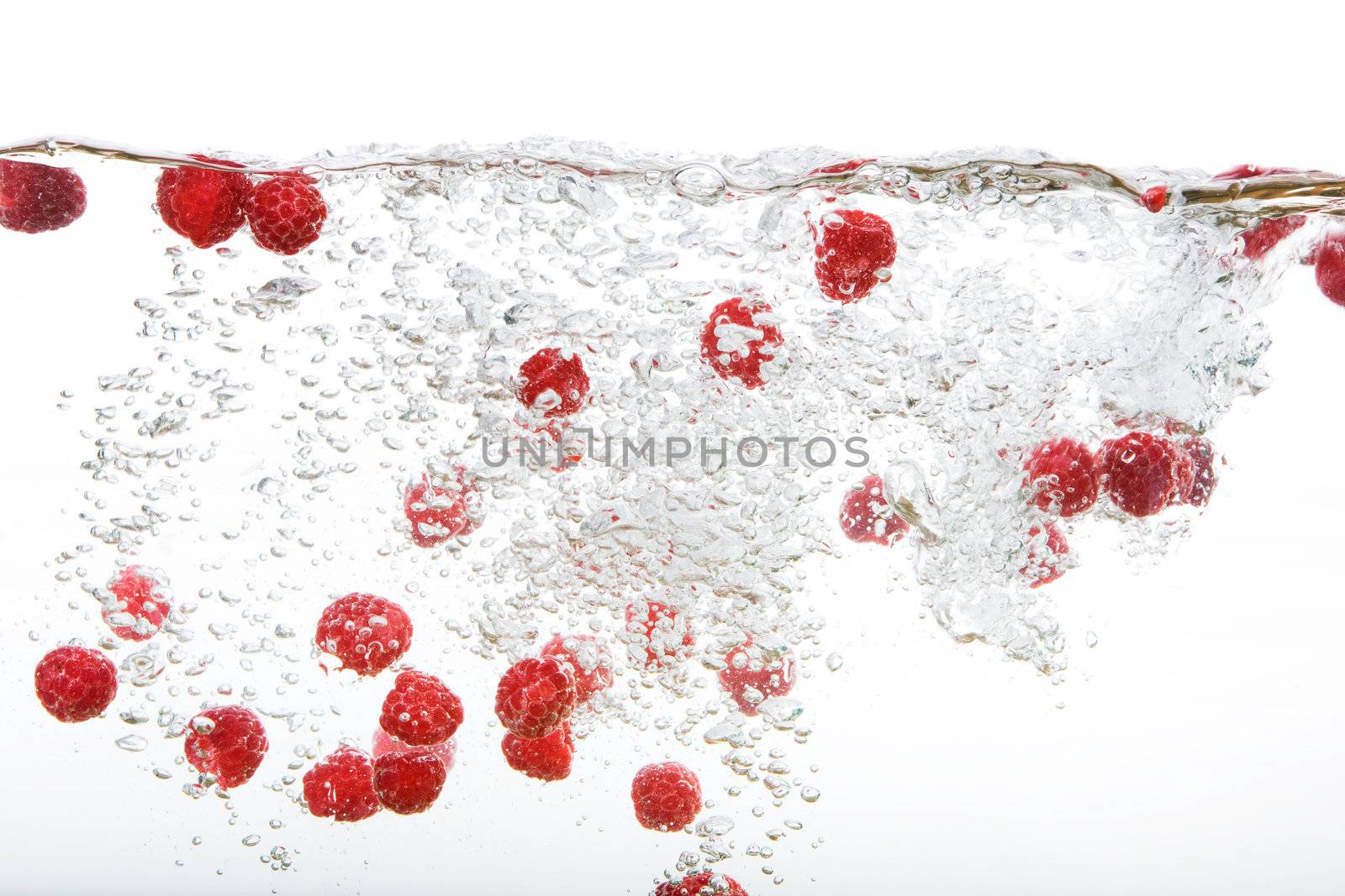 Fresh Raspberries in Water by leaf