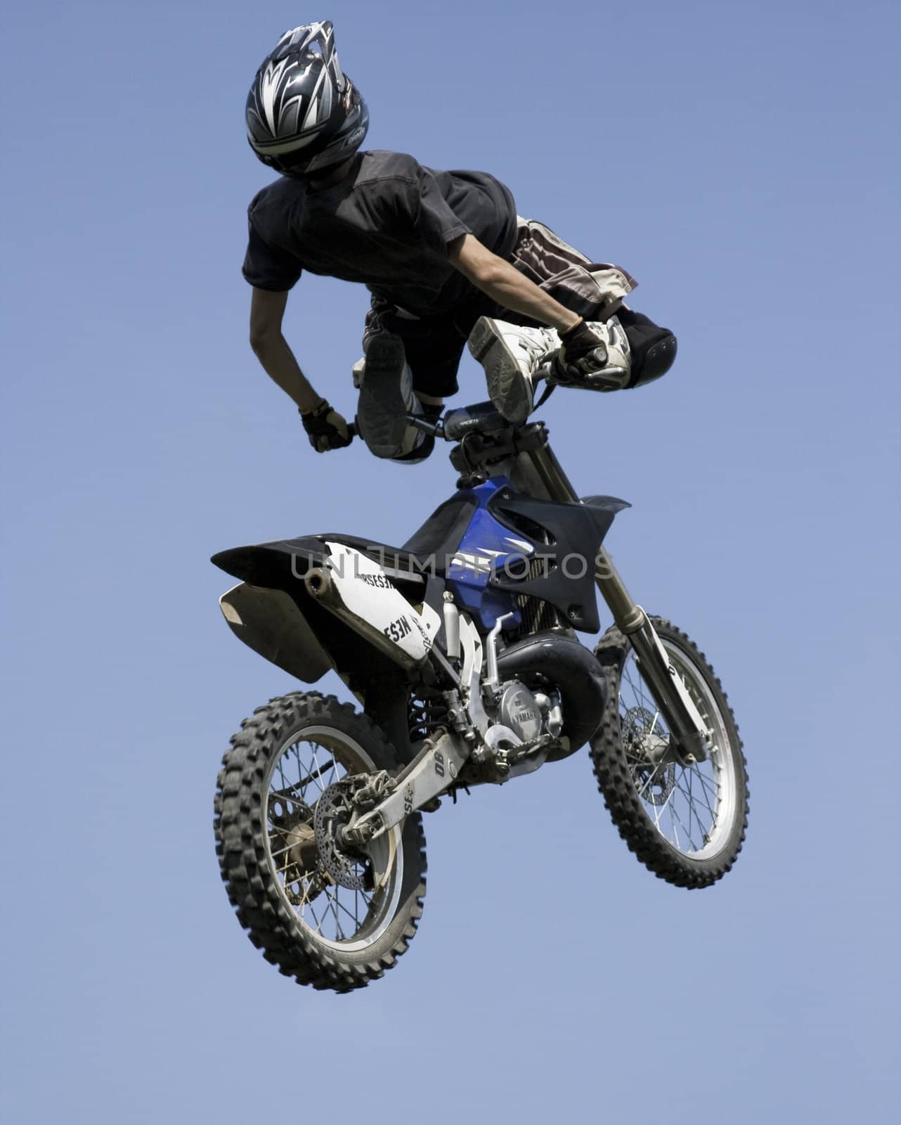 Outdoor shot, extreme rider performing a trick.