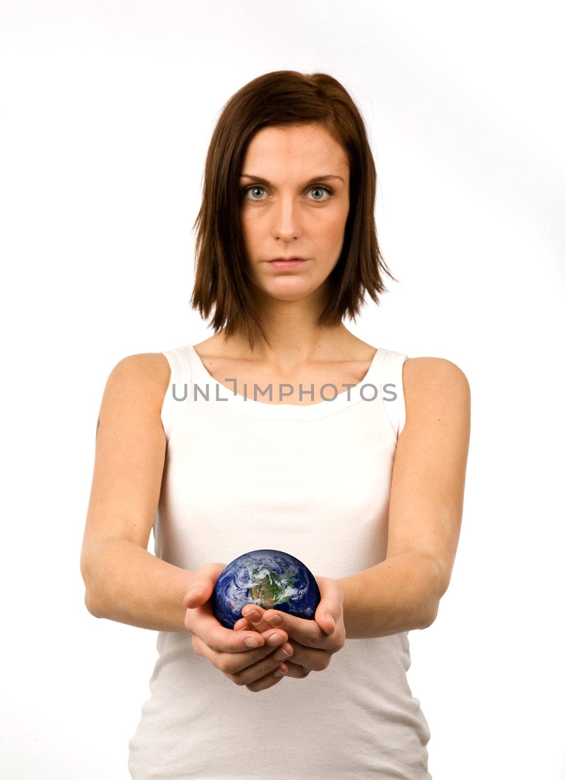 A young woman carefully holding the world