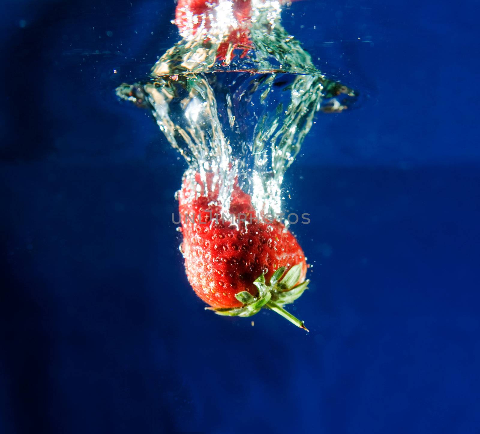 Strawberry in Water by leaf