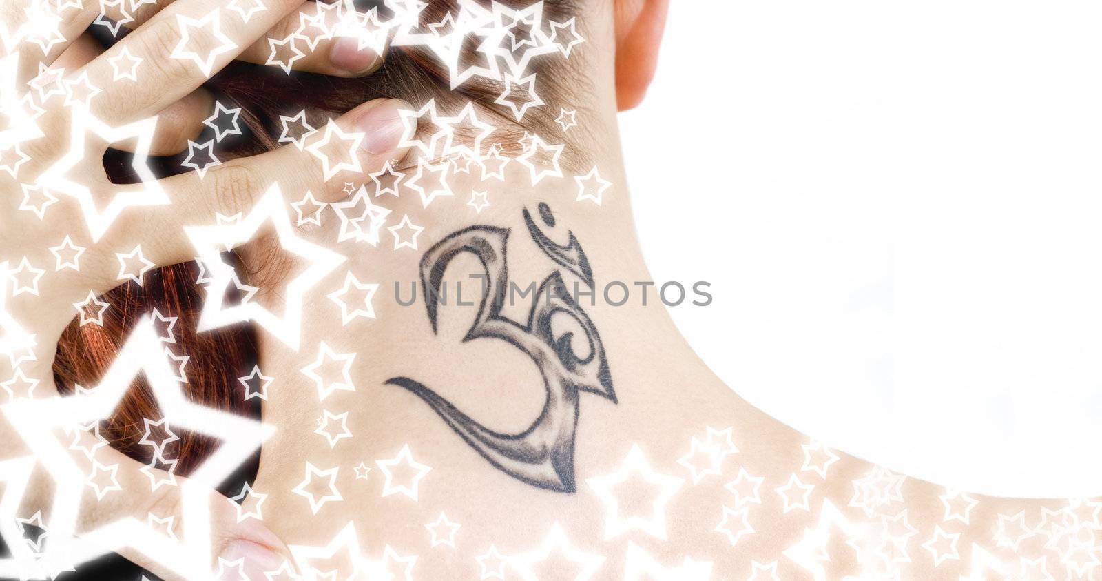 Close-up of an ohm tattoo covered with beautiful stars.