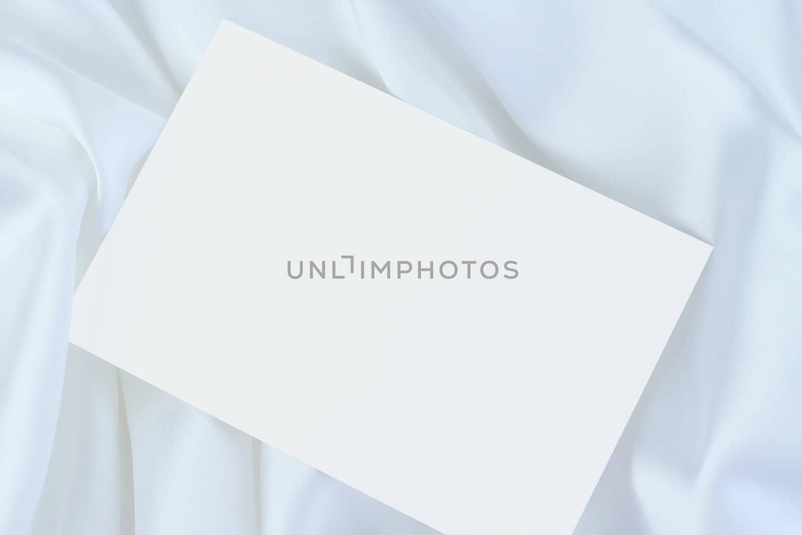 White blank card on white satin