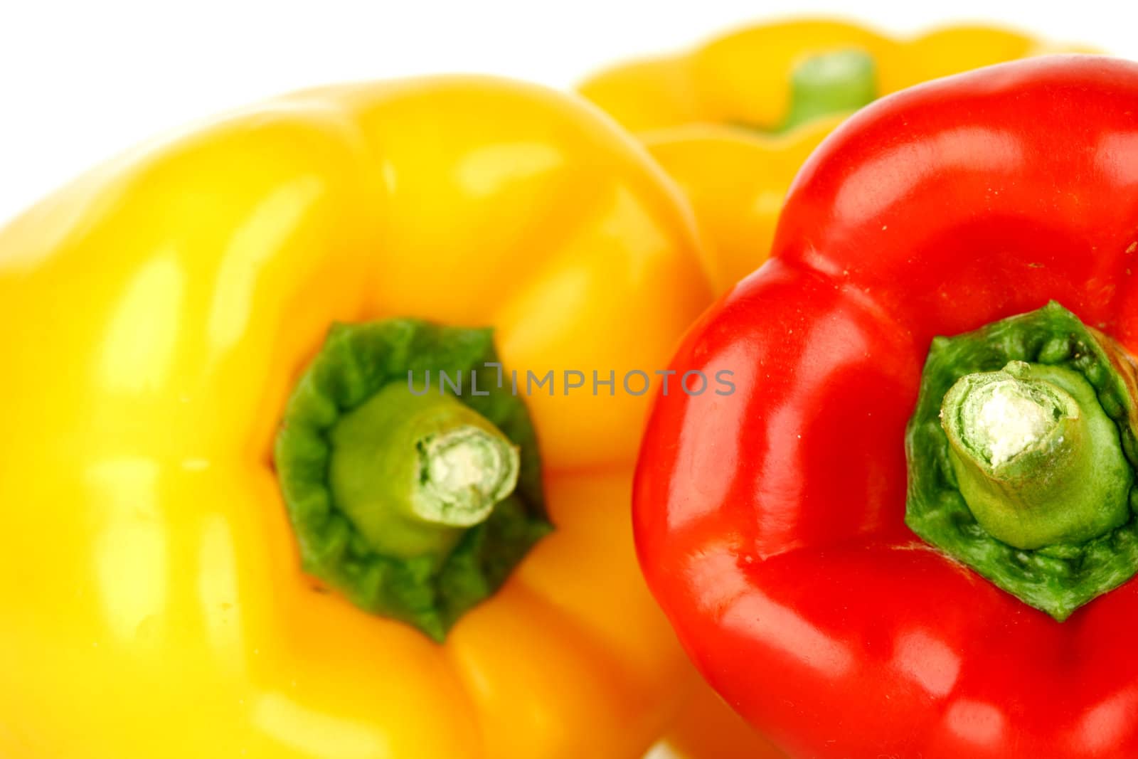  colored paprica isolated on white