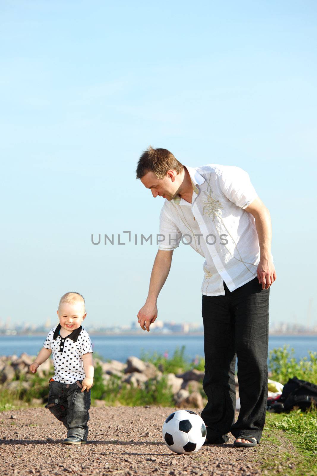 father and son play in soccer