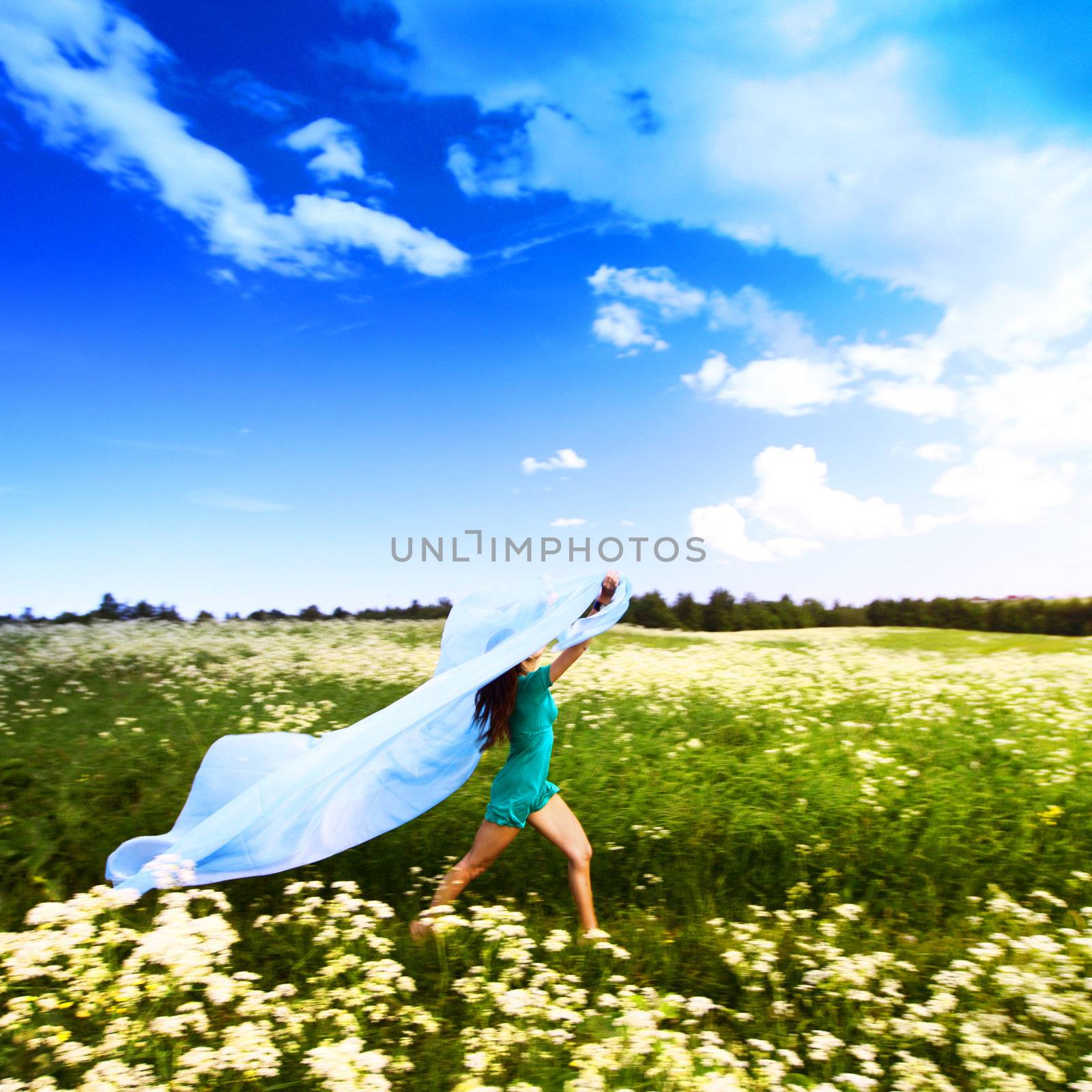  girl run by field fabric in hands fly behind like wings