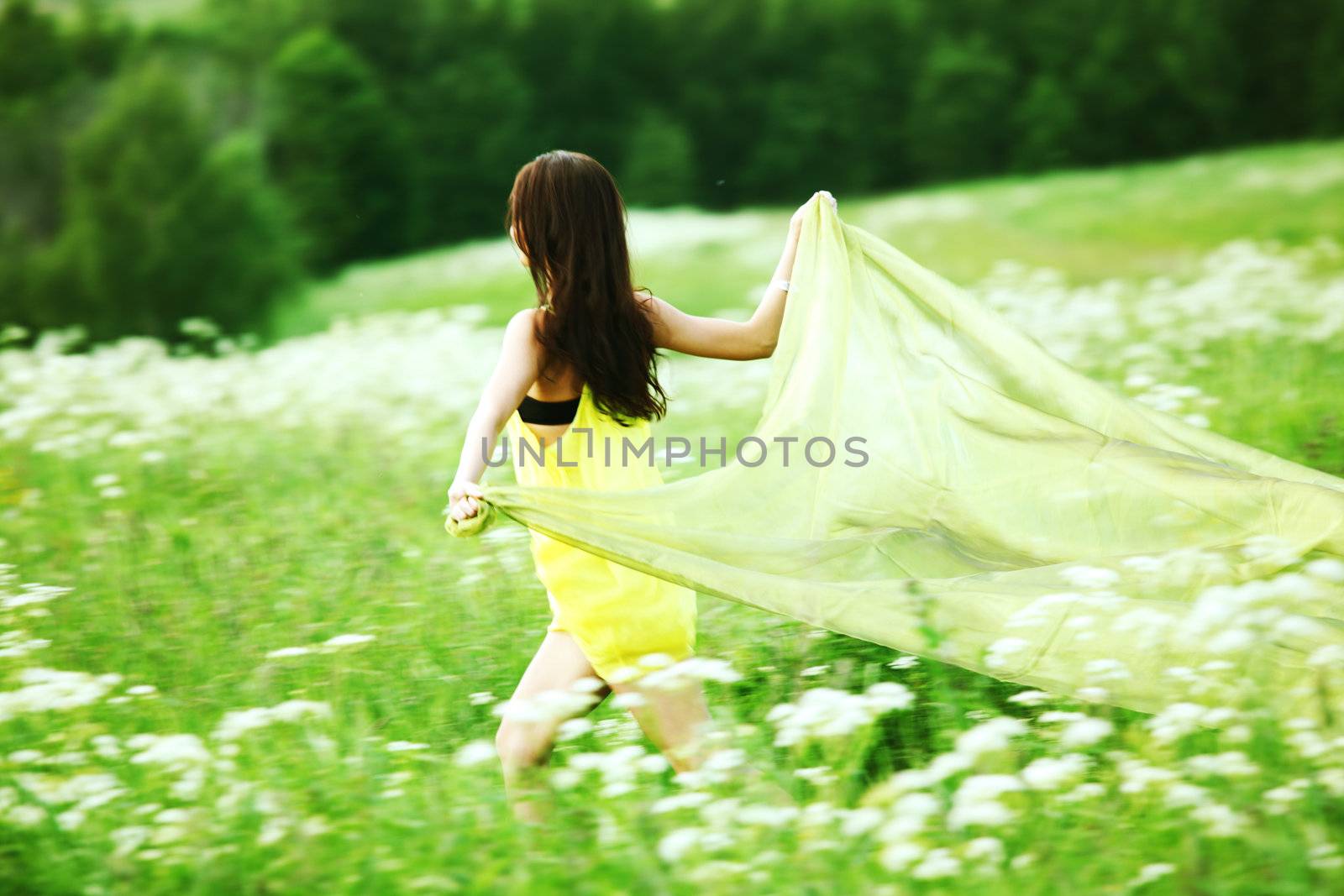  girl run by field fabric in hands fly behind like wings