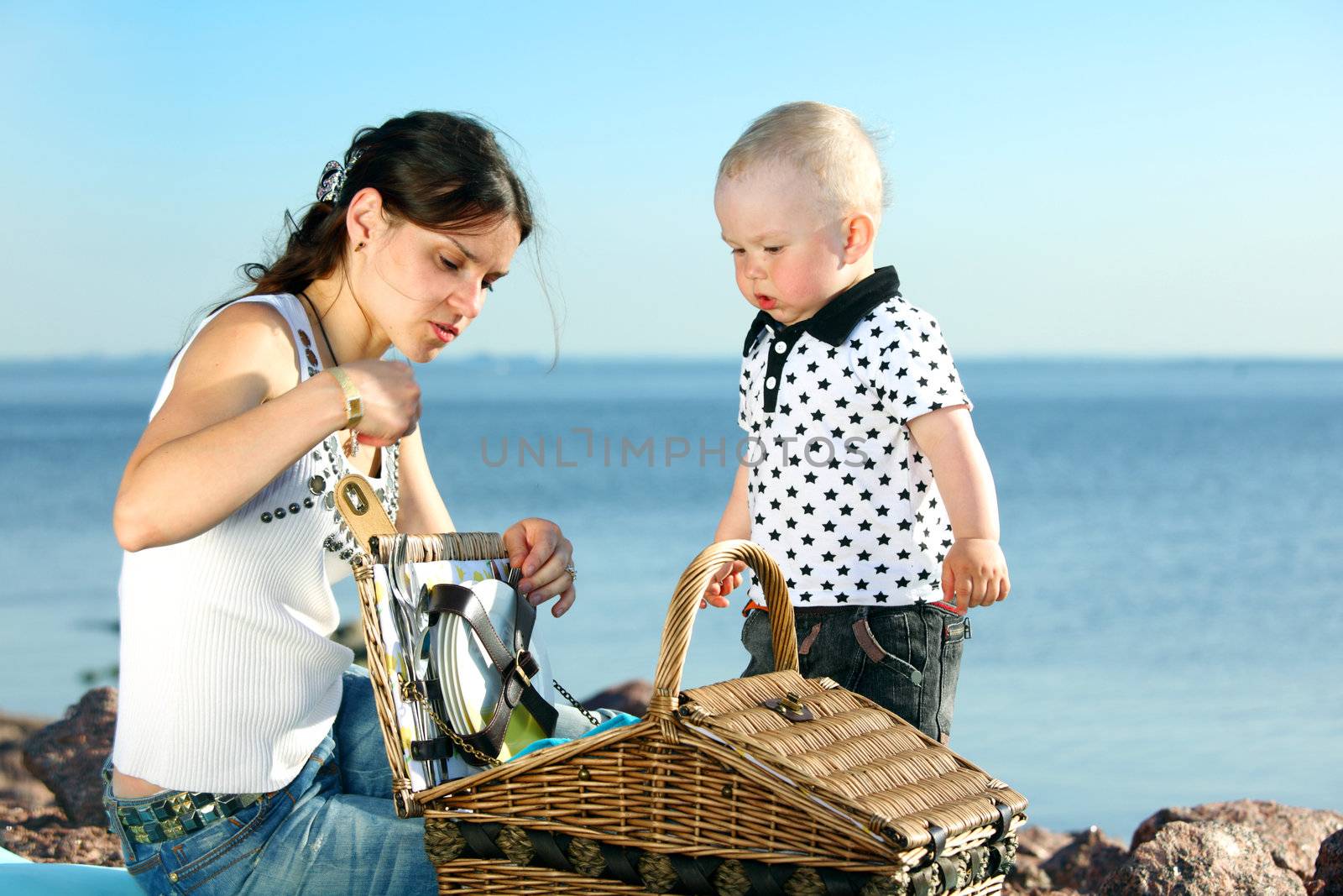 picnic of happy family near sea