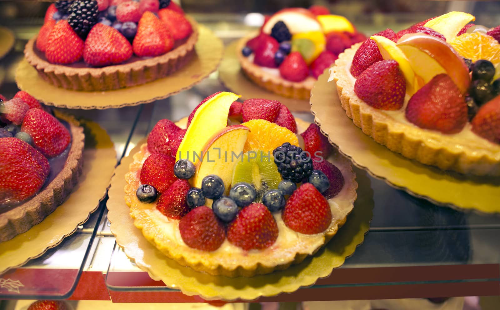 Mini strawberry tarts in bakery display